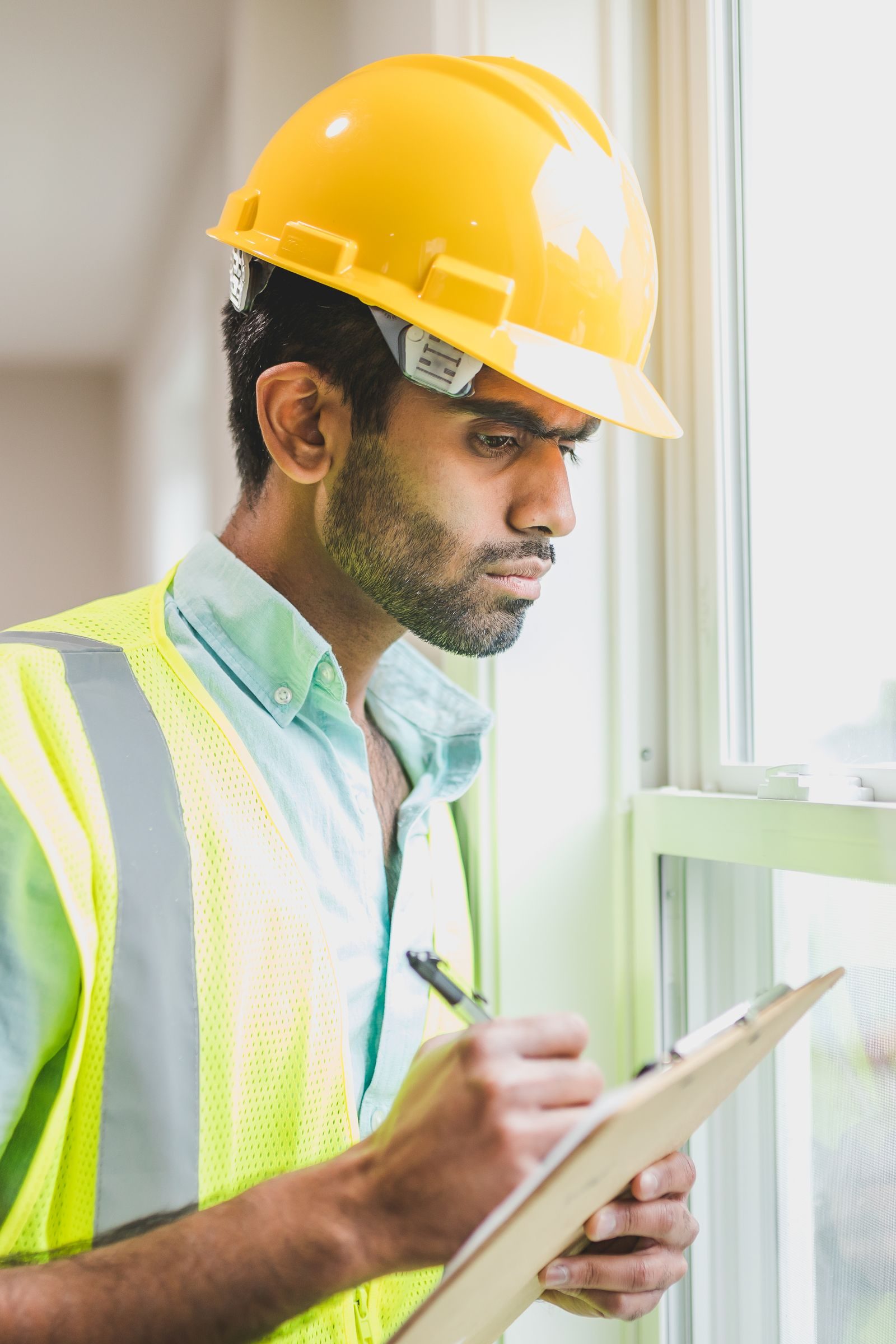 Technician inspecting a home with professional instruments